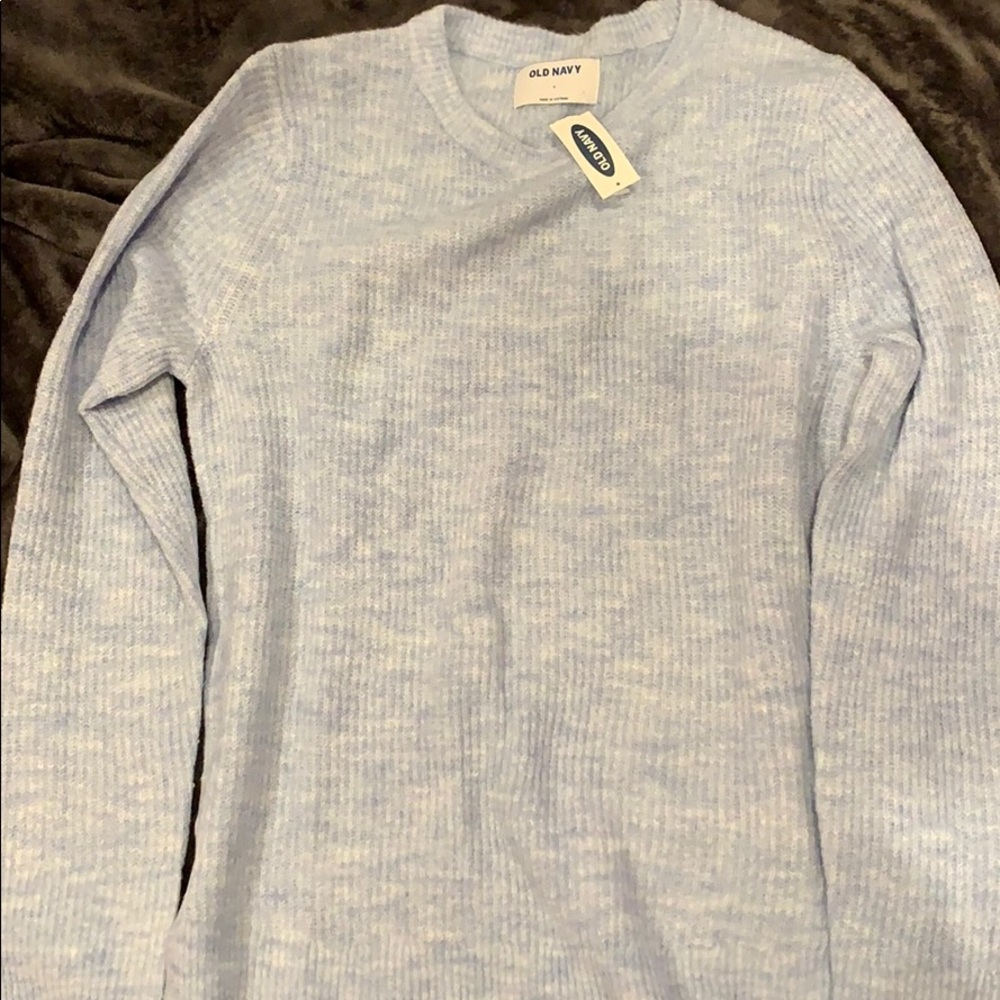A white and blue sweater